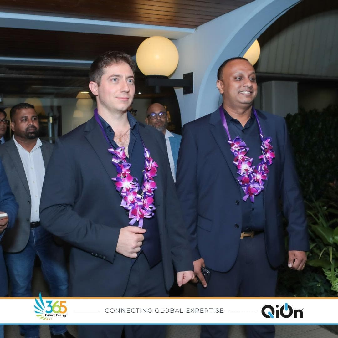 QiOn Founder and CEO Ludovico Finotto and 365 Future Energy CEO Isuru Yapa arriving in Sri Lanka with traditional flower lei welcome, marking the start of a strategic visit to explore large-scale battery storage, EV charging infrastructure, and sustainable energy investment opportunities in Sri Lanka