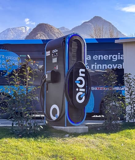 QiOn Maveriq DC fast charger unit showing compact industrial-grade design with cable management, used for fleet charging in the CVA V.I.T.A. public transport electrification project