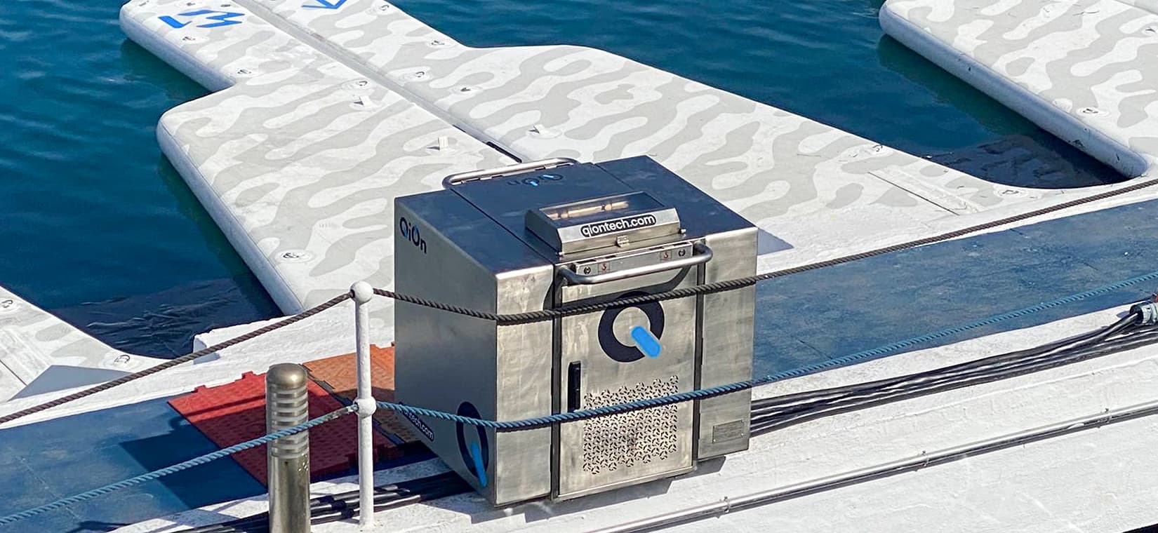 QiOn QUBE portable charging device at Puerto Banus pier
